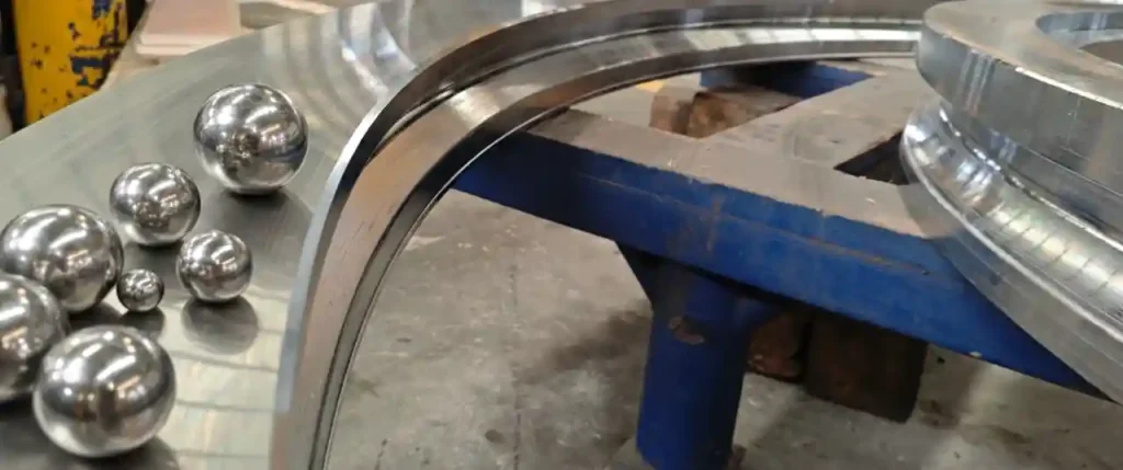 Why Do Harder Balls Fail Earlier Than the Raceway in Slewing Bearings?